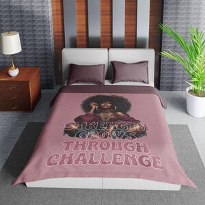 a bed room with a neatly made bed and a plant