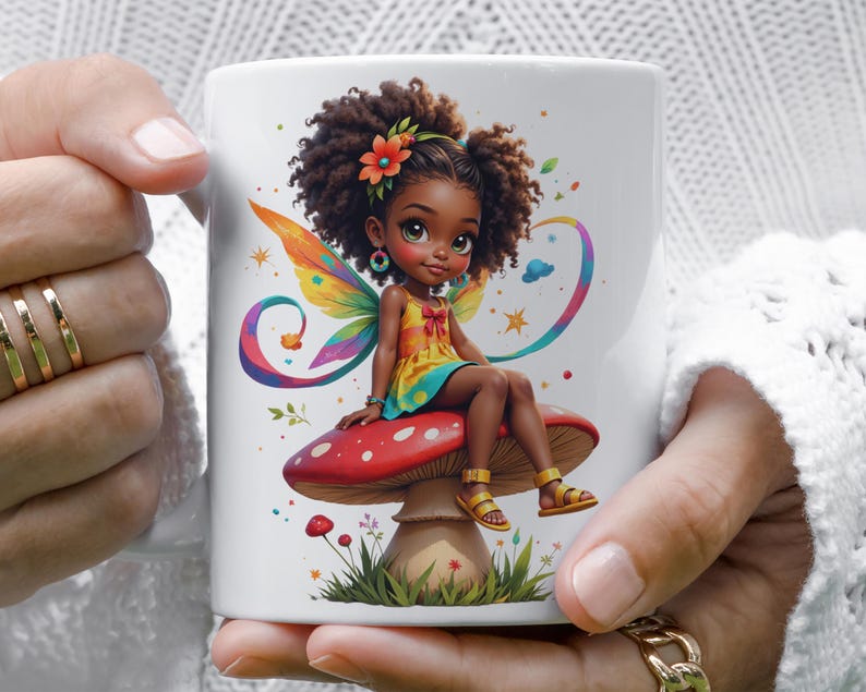 A person is holding a white mug with a colorful illustration of a fairy sitting on a mushroom.