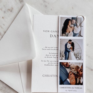 May include: A white wedding invitation with a photo strip of a couple. The invitation reads "VON GANZ DAN..." and "CHRISTINA & TOBIAS 23. April 2023".