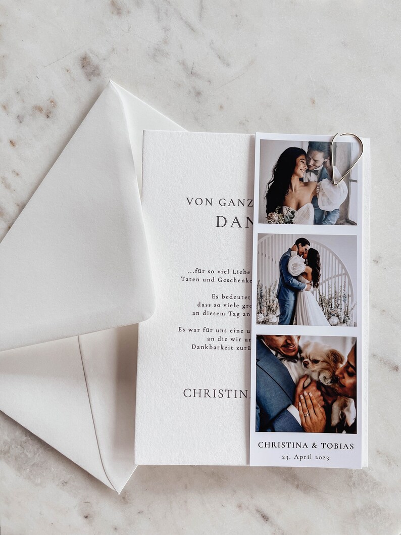 May include: A white wedding invitation with a photo strip of a couple. The invitation reads "VON GANZ DAN..." and "CHRISTINA & TOBIAS 23. April 2023".