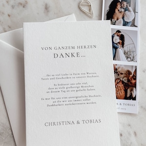 May include: A white card with black text that reads "Von ganzem Herzen Danke..." followed by a message of thanks for the love and support received at the wedding. The card also includes the names "Christina & Tobias" and the date "April 2023".