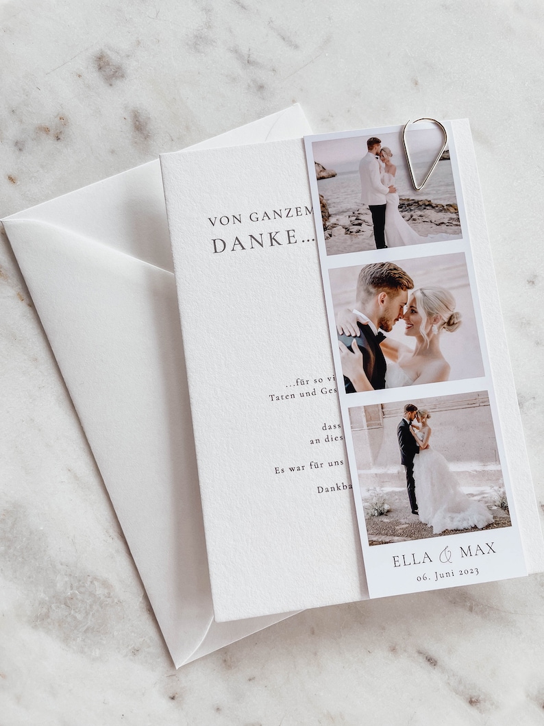 May include: A white card with the text "VON GANZEM DANKE..." and a photo collage of a wedding couple. The photos show the couple on a beach, kissing, and walking down the aisle. The card also includes the text "ELLA & MAX 06. Juni 2023".