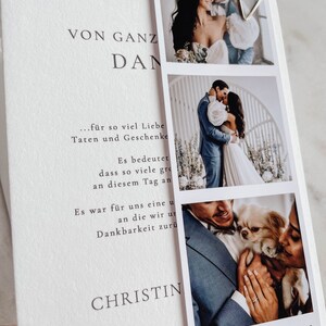 May include: A wedding announcement card with a white background and black text. The text reads "VON GANZ DAN...f&uuml;r so viel Liebe Taten und Geschenke Es bedeutet dass so viele gro&szlig;e Momente an diesem Tag an uns vorbeigezogen sind. Es war f&uuml;r uns eine unvergessliche Zeit, an die wir uns mit gro&szlig;er Dankbarkeit zur&uuml;ck erinnern werden. CHRISTIN" and "CHRISTINA & TOBIAS 23. April 2023". The card features three photos of the couple, including one with their dog.
