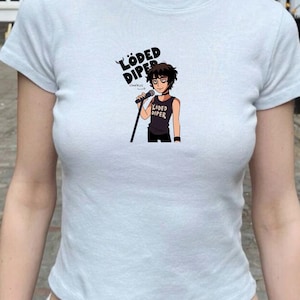 May include: White ceramic mug with a black handle, featuring the text "But First, Coffee". The mug is designed for hot drinks, with a capacity of approximately 340-450ml.