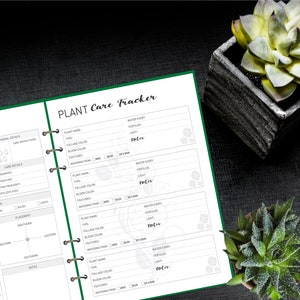 May include: A green and white planner with the title "PLANT Care Tracker" on the cover. The planner has sections for plant name, type, foliage color, bloom color, features, watering from, water every, fertilize, light, and notes.