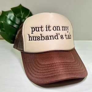 embroidered put it on my husband’s tab trucker hat