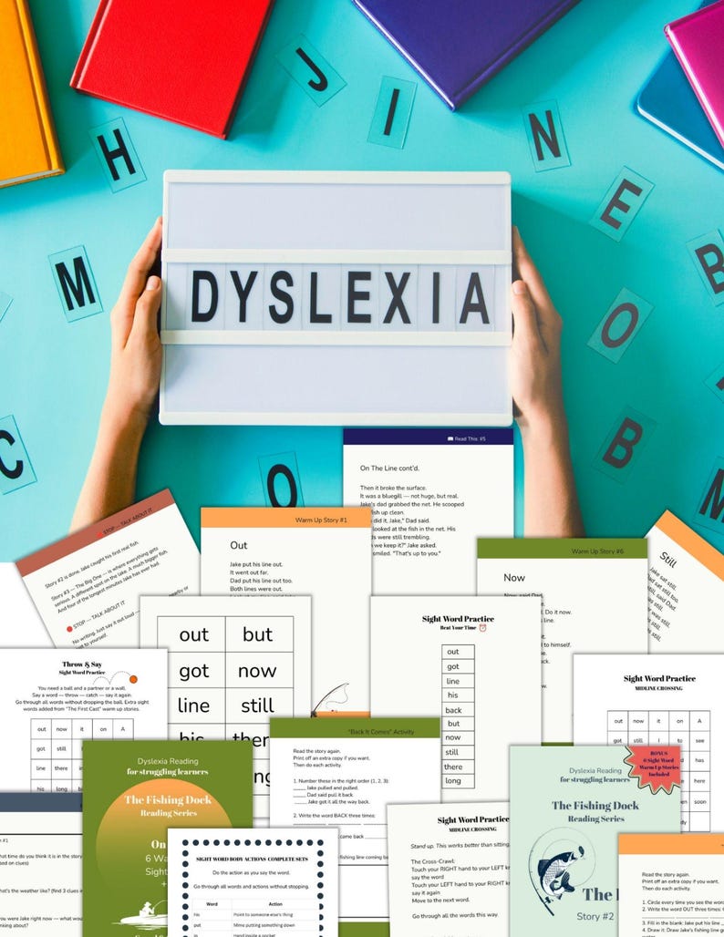 May include: A white light box displaying the word DYSLEXIA in black letters, held above a collection of educational reading worksheets and activity pages from The Fishing Dock Reading Series, scattered across a bright turquoise surface.