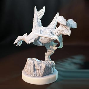 May include: A white, 3D-printed figurine of a creature with a bird-like head, insect-like armor, and large wings. The figurine is posed on a rocky base atop a circular platform. The creature has sharp claws and a dynamic pose.