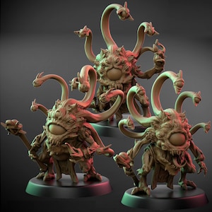 May include: Three detailed miniature fantasy figures of a multi-eyed monster with multiple snake-like appendages. The figures are brown with a single large eye and are posed on black circular bases. The figures are designed for tabletop gaming.
