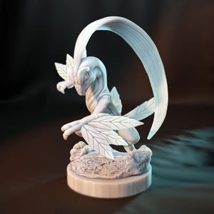 May include: A light gray fantasy creature sculpture with leaf-like wings and a curved blade. The creature is posed on a rocky base atop a circular platform. The sculpture is detailed and appears to be made of a solid material.