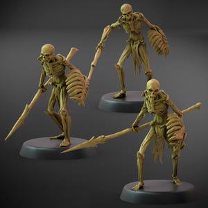 May include: Three skeletal figures, each posed on a black base. The figures are a tan color, with ribcage shields and spears. The figures have a menacing appearance, with detailed bone structures and skull faces. The figures are likely miniatures or figurines.