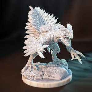 May include: A detailed, white figurine of a fantasy creature with a reptilian head, sharp claws, and a feathered back. The creature is posed on a small, round base, with a textured, scaly body and open mouth.