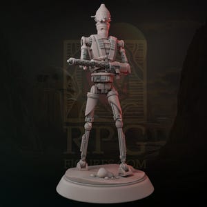 May include: A light gray figurine of a humanoid robot, holding a large weapon. The robot stands on a circular base with small rocks. The background is a dark gradient with the text "RPG FIGURES COM".