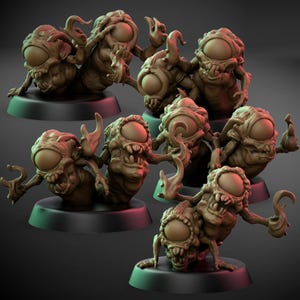 May include: A collection of brown monster figurines with large, single eyes and multiple arms. Each figure is posed differently and mounted on a black circular base. The figures have a detailed, textured appearance.