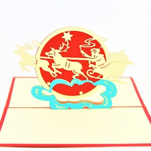 Handmade 3D popup Xmas card Santa Claus flying reindeer greeting