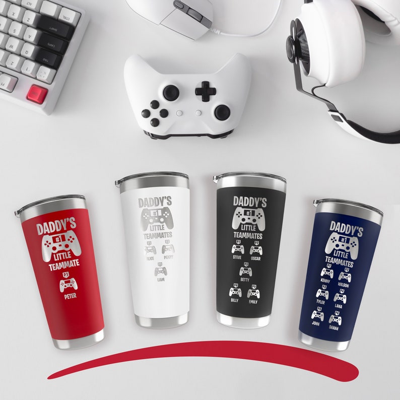 May include: Four stainless steel tumblers with a red, white, black, and blue finish. Each tumbler features a graphic of a video game controller with the text "Daddy's #1 Little Teammates" and a list of names below.