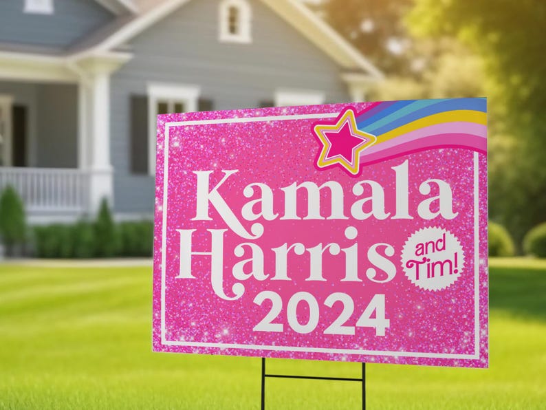 May include: Pink and white yard sign with glitter and a rainbow design. The sign reads "Kamala Harris 2024" and has a small circle with the text "and Tim!"