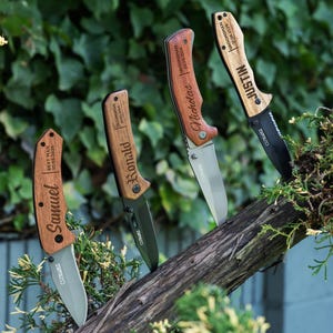 May include: Four personalized pocket knives with wooden handles. The handles are engraved with the names "Samuel", "Ronald", "Nicholas", and "Justin".