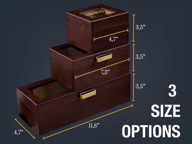 May include: Three wooden boxes with glass lids and gold accents. The boxes are stacked on top of each other and labeled with their dimensions in inches. The largest box is 11.8 inches wide, 4.7 inches tall, and 3.5 inches deep. The middle box is 7.3 inches wide, 4.7 inches tall, and 3.5 inches deep. The smallest box is 4.7 inches wide, 4.7 inches tall, and 3.5 inches deep.