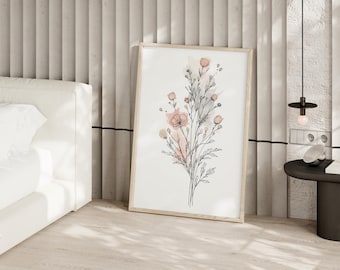 May include: A framed wall art print featuring a black line drawing of a wildflower bouquet with soft, muted pink watercolor accents. The artwork is displayed in a light-colored wooden frame, showcasing delicate stems, leaves, and small flower buds.