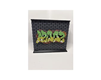 Placa de identificación de pared con grafiti