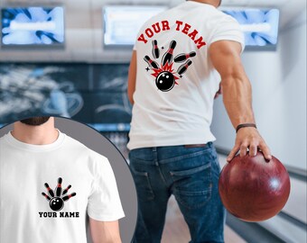 May include: White t-shirt with a bowling design. The front features a bowling pin and ball graphic with the text "YOUR NAME". The back of the shirt has the words "YOUR TEAM" in red, with a bowling ball and pins graphic. The person is holding a red bowling ball.