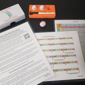 May include: A white box with the words "Sovereign Seed Roll" printed on it, along with a set of instructions for using the product. The instructions include a QR code and a checklist for calculating a checksum word. There is also a white dice with red numbers and a small orange tray with three white dice.