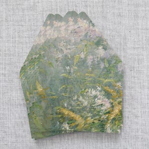 May include: A stack of three decorative paper cards with a scalloped edge. The cards feature a soft, impressionistic painting of a garden scene with green, yellow, and white brushstrokes. The artwork evokes a sense of nature and tranquility.