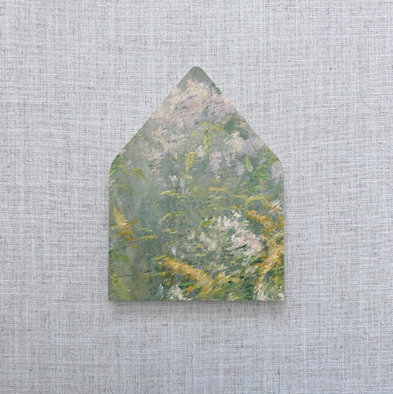 May include: A house-shaped art print featuring a soft, impressionistic landscape painting. The artwork showcases a blend of green, yellow, and white hues, evoking a natural, serene scene. The print is set against a neutral, textured background.