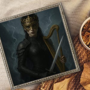 May include: Framed artwork featuring a woman in a gold mask and crown, holding a harp and sword. She wears black armor against a dark, stormy background. The artwork is in a silver frame, with a bowl of dried flowers and a leaf in the background.