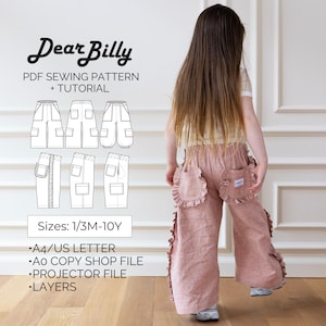 May include: A child wearing pink pants with ruffled pockets and accents. The image also shows a PDF sewing pattern with the text "Dear Billy" and "PDF Sewing Pattern + Tutorial". The pattern includes sizes from 1/3M to 10Y.