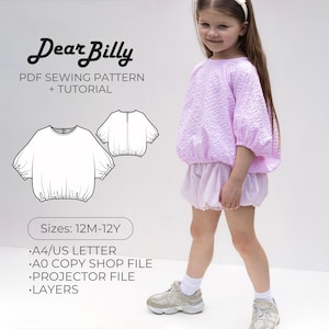 May include: Dear Billy PDF sewing pattern and tutorial for a light purple textured blouse with puff sleeves and matching shorts. Includes technical line drawings, sizes 12M-12Y, A4/US letter, A0 copy shop file, projector file, and layers for digital printing.
