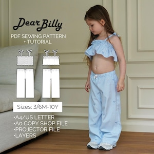 May include: A child wearing a blue and white striped pajama set. The set includes a ruffled crop top and wide-leg pants. The image also shows a sewing pattern with the text "Dear Billy" and "PDF Sewing Pattern + Tutorial". Sizes are listed as 3/6M-10Y.