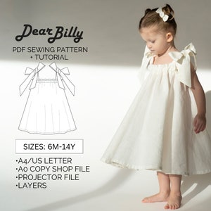 Könnte beinhalten: Ein weißes Kleid mit einem gerafften Oberteil und großen Schleifen an den Trägern. Das Kleid wird von einem jungen Mädchen getragen. Der Text "Dear Billy PDF Sewing Pattern + Tutorial Sizes: 6M-14Y •A4/US LETTER •Ao COPY SHOP FILE •PROJECTOR FILE •LAYERS" ist unter dem Kleid gedruckt.