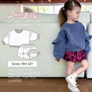 May include: A PDF sewing pattern for a girls' top and skirt set, called "Dear Billy". The pattern includes sizes 9 months to 12 years. The pattern is shown on a white background with a line drawing of the top and skirt. The pattern includes instructions for making the top and skirt.
