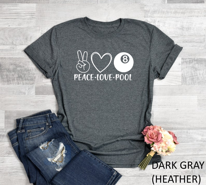 May include: Dark grey heather t-shirt with a white peace sign, heart, and 8-ball graphic. The text "Peace-Love-Pool" is printed below the graphic.