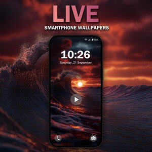 May include: A smartphone screen displaying a live wallpaper of a large wave crashing in the ocean at sunset. The time is 10:26 and the date is Saturday, 21 September.