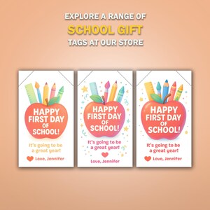 May include: Three school gift tags with an apple design. Each tag has the text "Happy First Day of School!" and "It's going to be a great year!" with a heart and the name "Jennifer". The tags feature pencils, a ruler, and crayons.