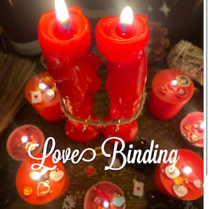 May include: Two red figural candles shaped like human forms are bound together with twine, surrounded by several smaller red votive candles. The text "Love Binding" is written in white script, and "Stay Magical Boutique" appears below.