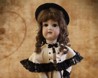 27 inch Armand Marseille Bisque doll in custom silk Victorian gown and cape.