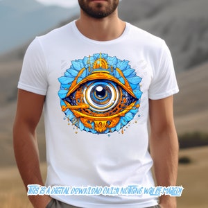 May include: A white t-shirt with a colorful graphic of an eye surrounded by blue and gold floral designs. The eye is blue with a gold iris and pupil.
