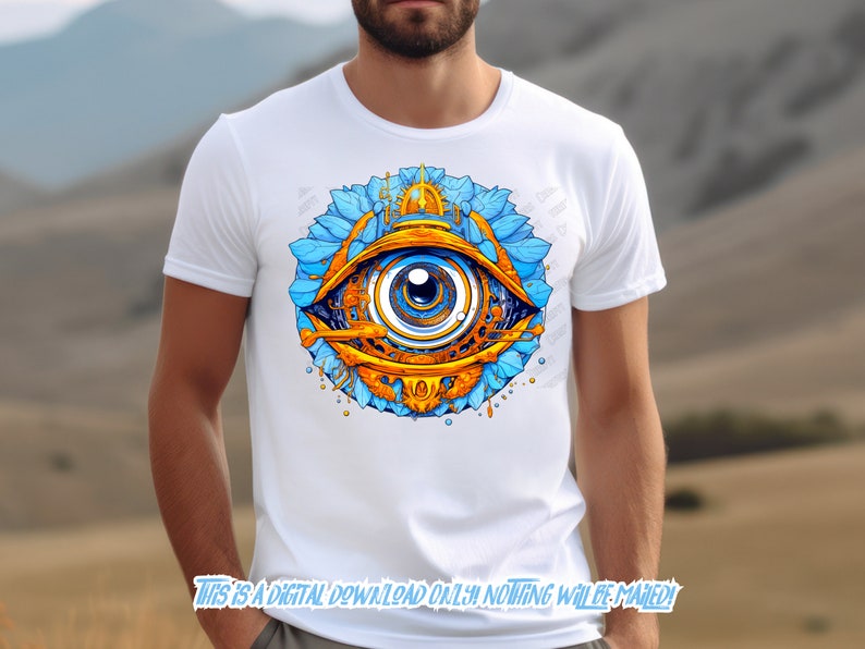 May include: A white t-shirt with a colorful graphic of an eye surrounded by blue and gold floral designs. The eye is blue with a gold iris and pupil.