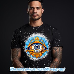 May include: A black t-shirt with a white splatter pattern and a colorful graphic of an eye with blue, yellow, and orange details. The eye is surrounded by blue and yellow floral designs.