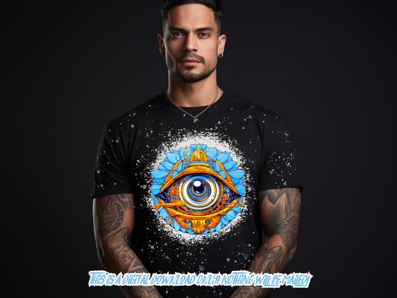 May include: A black t-shirt with a white splatter pattern and a colorful graphic of an eye with blue, yellow, and orange details. The eye is surrounded by blue and yellow floral designs.