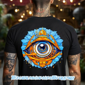 May include: A black t-shirt with a colorful graphic of a large eye surrounded by blue and gold floral elements. The eye is detailed with gears and other mechanical elements.