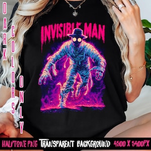 Puede incluir: Camiseta negra con un gráfico de neón del Hombre Invisible, envuelto en vendas y con sombrero. El diseño utiliza tonos neón azul, morado y rosa, con el texto "INVISIBLE MAN" sobre la figura. Las palabras "DARK COLORS ONLY" están impresas verticalmente a la izquierda.