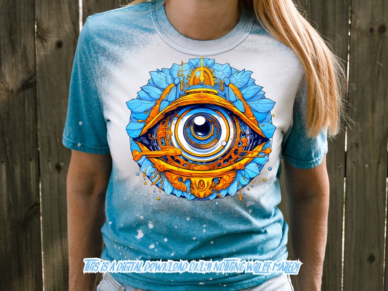 May include: A blue and white tie-dye t-shirt with a graphic of a large, detailed eye with gold and blue accents. The eye is surrounded by blue and gold floral designs.