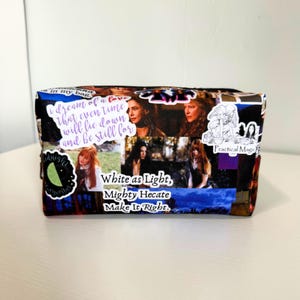 May include: A rectangular zippered pouch featuring a collage of scenes and quotes from the movie Practical Magic. The fabric displays images of characters, a lime slice graphic, and text including "White as Light, Mighty Hecate Make It Right."