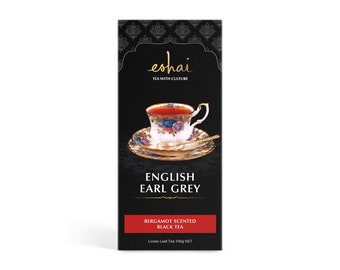 May include: A black box with gold lettering that reads "eshai TEA WITH CULTURE" and "ENGLISH EARL GREY BERGAMOT SCENTED BLACK TEA" with a picture of a cup of tea and a saucer. The box also says "Loose Leaf Tea 100g NET".