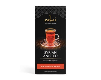 May include: A black box of "eshai" tea with a gold logo and a cup of tea on a saucer. The box reads "SYRIAN ANISEED" and "BLACK TEA WITH ANISEED". The tea is loose leaf and the net weight is 100g.